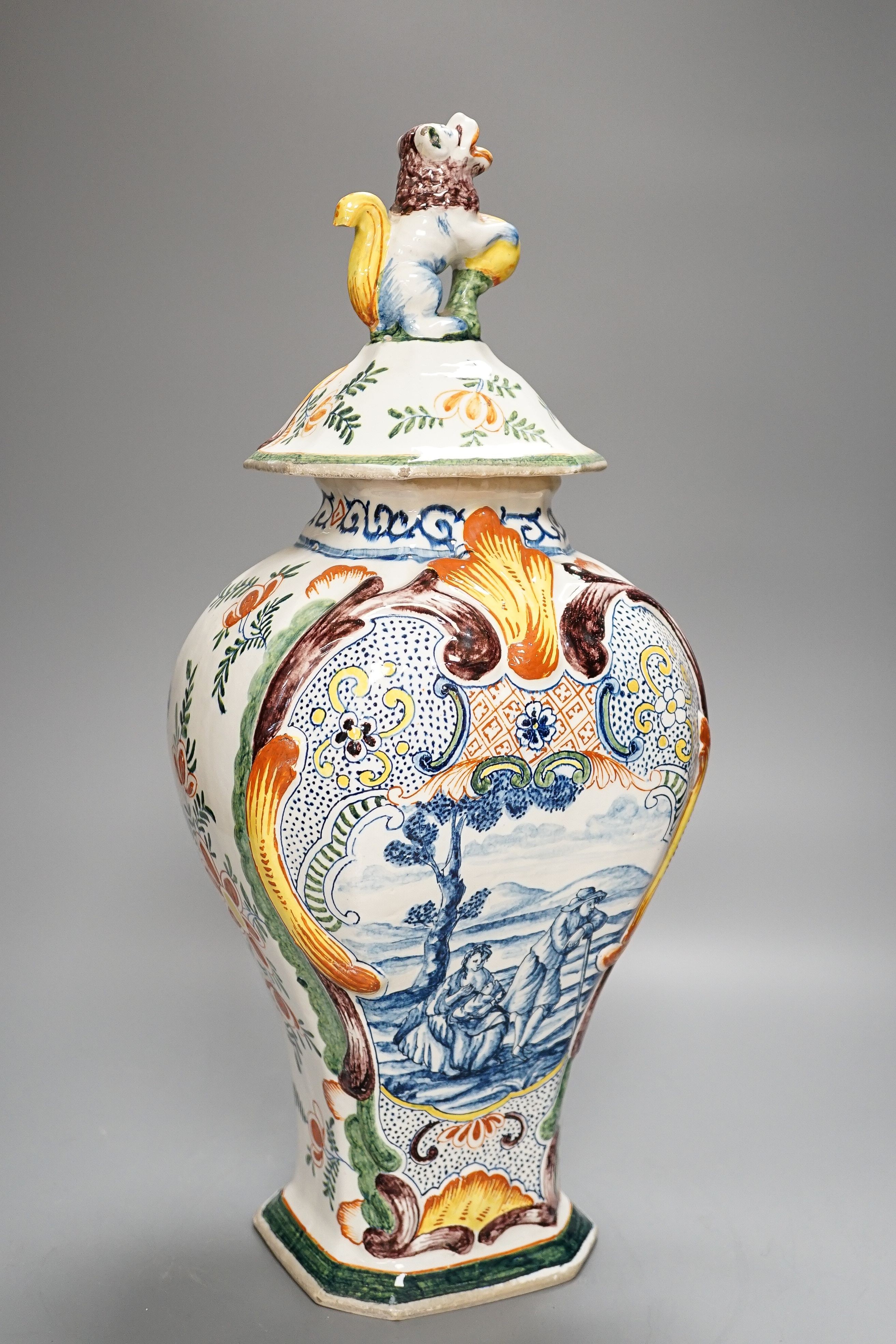 A large 19th century Delft polychrome vase and cover, 46cm, some damage